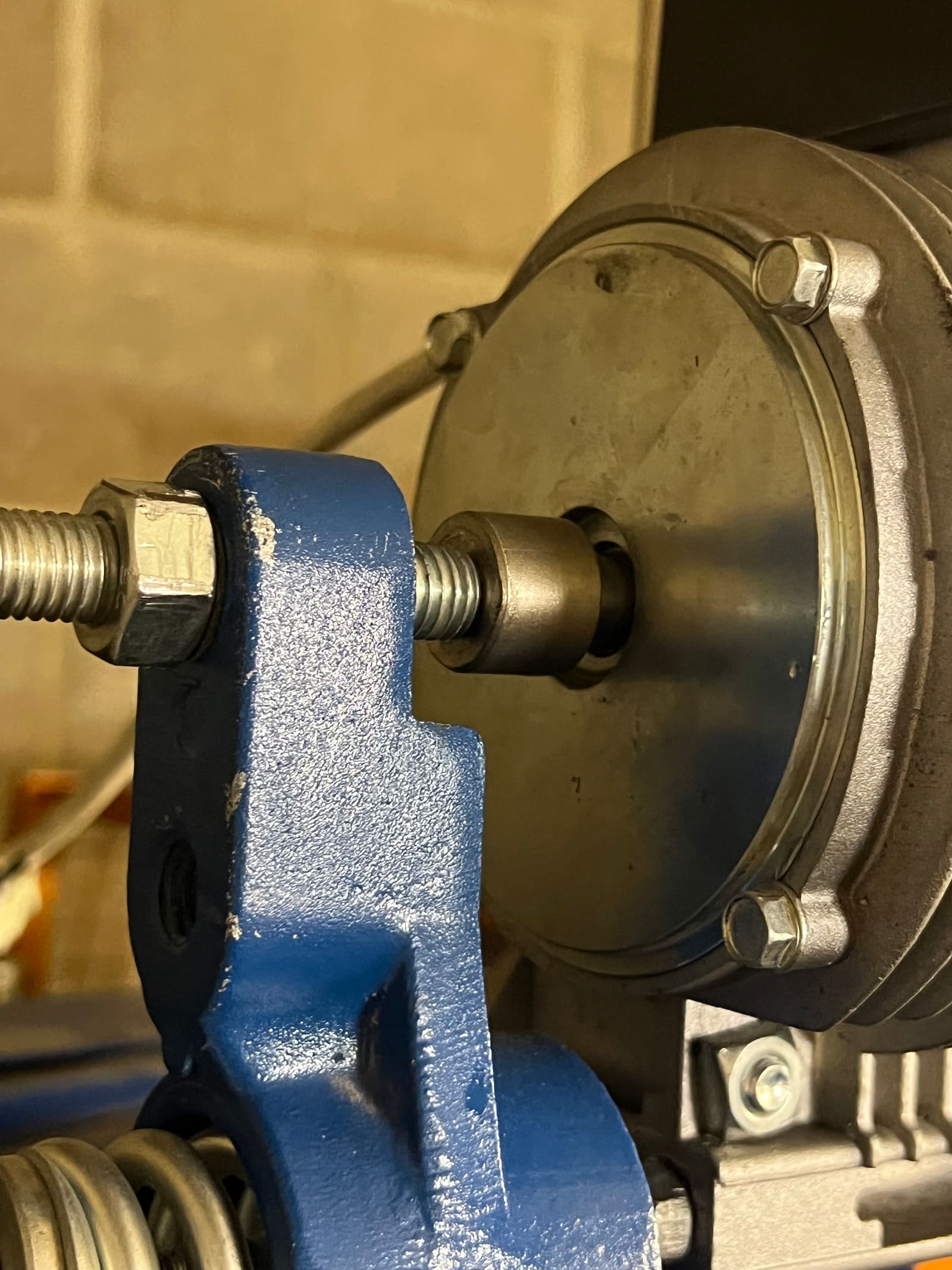 Lift machine brake arm and coil housing during hand adjustment
