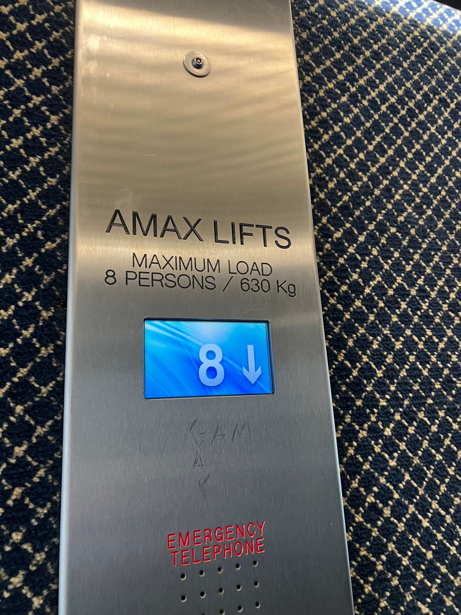 Stainless steel lift car operating panel with the floor display showing level 8