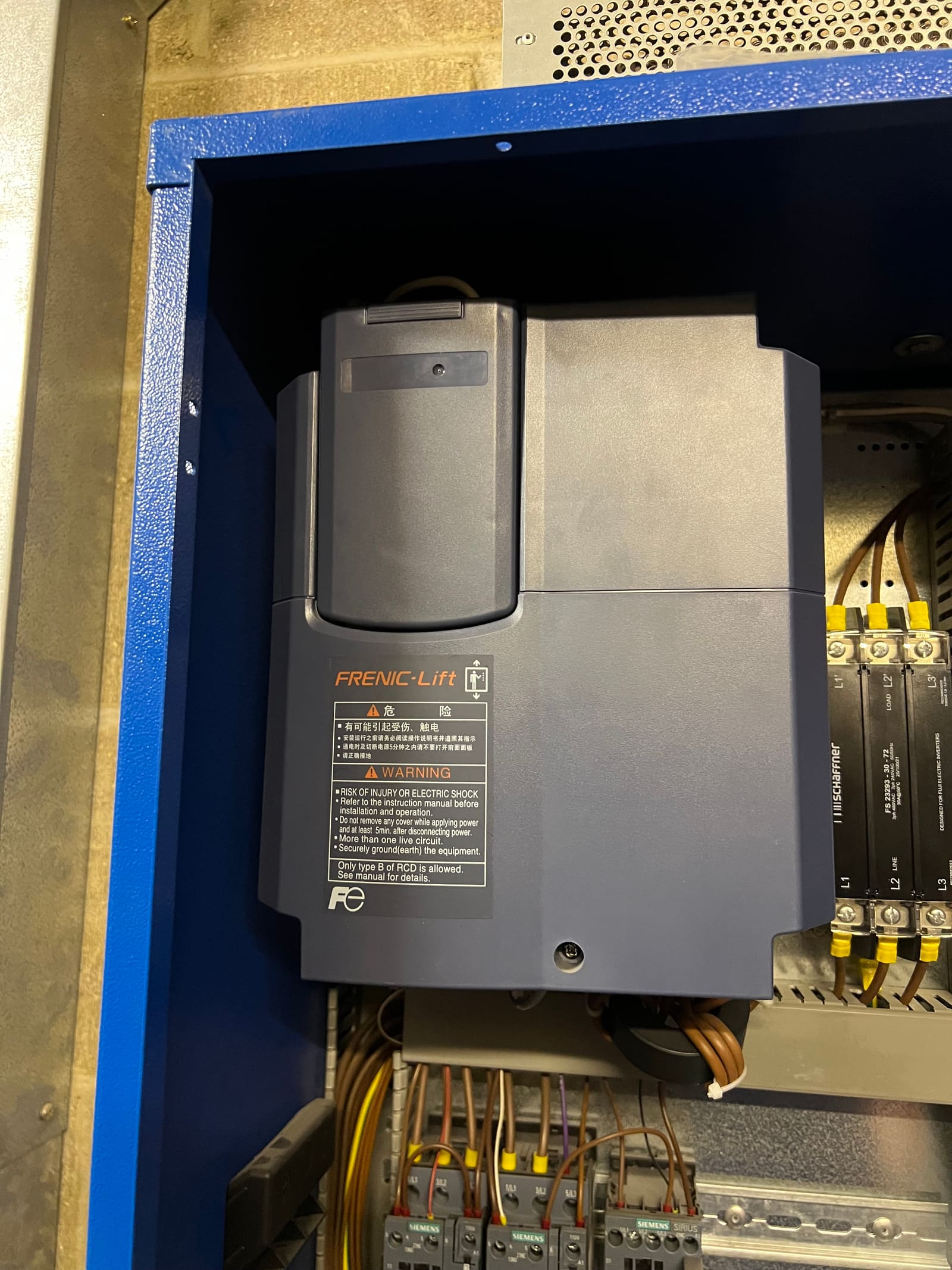 Fuji FRENIC-Lift variable-frequency drive mounted in the blue controller cabinet