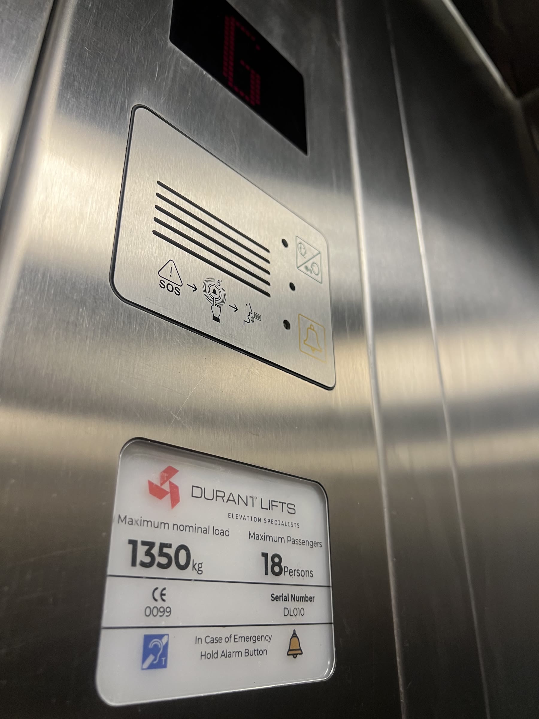Accessible lift control panel with tactile and braille alarm buttons