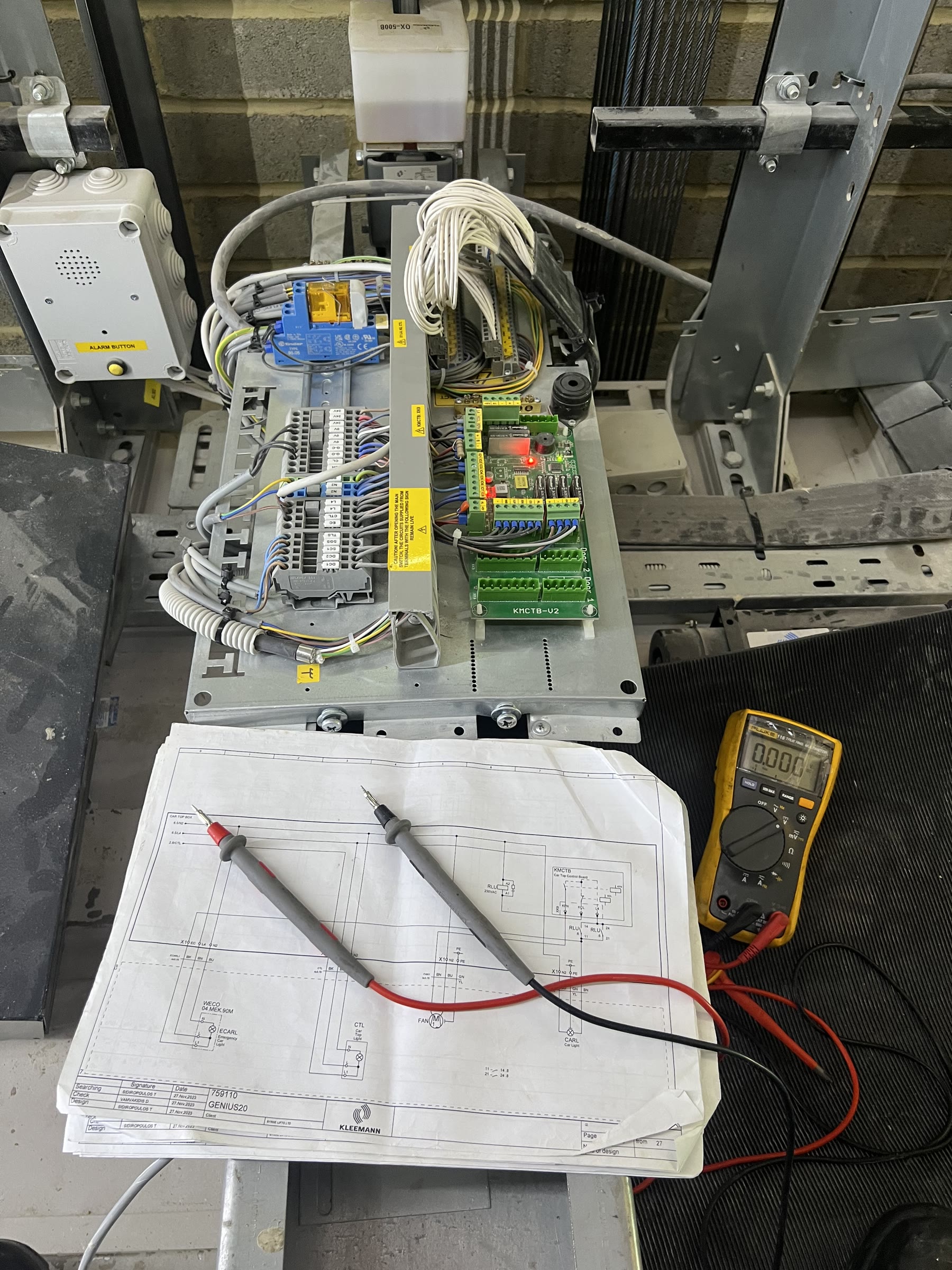 Lift controller fault finding with a multimeter on a wiring schematic