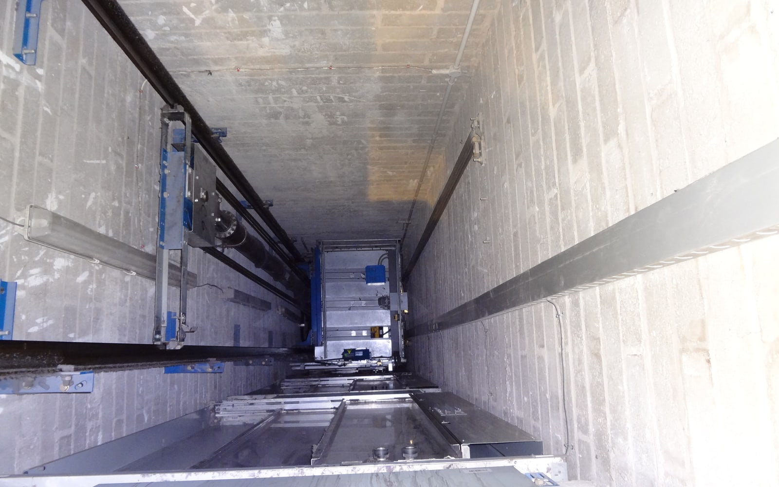 Hydraulic lift shaft showing the ram and lift car arrangement