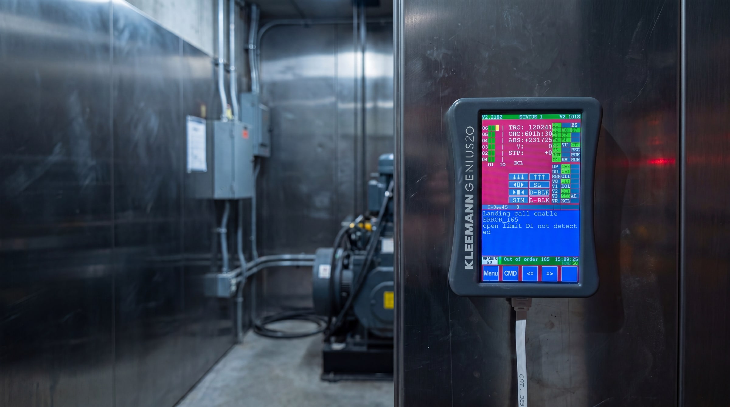Lift controller handset displaying an out-of-order fault code during a breakdown call-out