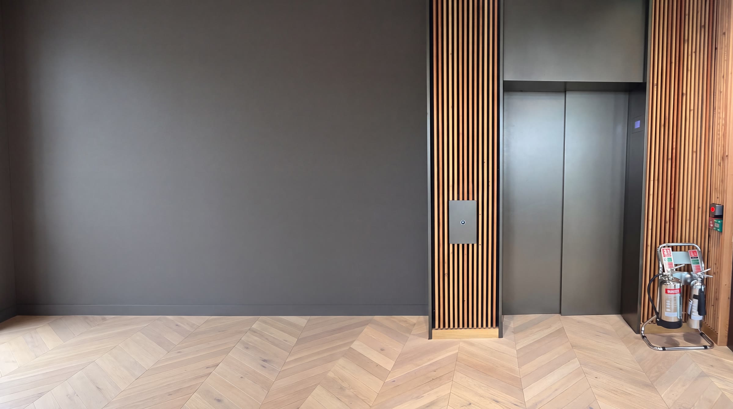 Passenger lift lobby in a residential apartment block of the kind covered by a leaseholder maintenance contract